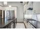 Modern kitchen featuring stainless steel appliances, stone countertops and marble backsplash at 1148 Grand Traverse Pkwy, Reunion, FL 34747