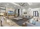 Spacious living room featuring a sleek fireplace, recessed lighting, and comfortable seating, great for gatherings at 1148 Grand Traverse Pkwy, Reunion, FL 34747