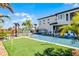 Amazing backyard with a pool, water features, and an artificial turf area for recreation at 1148 Grand Traverse Pkwy, Reunion, FL 34747