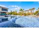 Beautiful swimming pool and spa area, complete with a small bridge and lush tropical landscaping at 1148 Grand Traverse Pkwy, Reunion, FL 34747