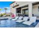 Luxurious pool featuring in-water loungers, a bridge to the home, and stunning backyard views at 1148 Grand Traverse Pkwy, Reunion, FL 34747