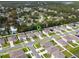 An aerial view shows the location of the house within the neighborhood in a lush, green area at 1150 August Sky Dr, Deltona, FL 32738