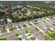 An aerial view showcasing the neighborhood and the surrounding area with lots of trees at 1150 August Sky Dr, Deltona, FL 32738