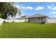 Spacious backyard featuring a well-maintained lawn and a white vinyl fence for added privacy at 1150 August Sky Dr, Deltona, FL 32738