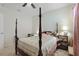 Bedroom featuring a four-poster bed, ceiling fan and comfortable furnishings at 1150 August Sky Dr, Deltona, FL 32738