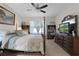 Cozy bedroom featuring a ceiling fan, wood furniture and a calm, relaxing atmosphere at 1150 August Sky Dr, Deltona, FL 32738