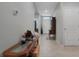 Inviting hallway featuring tile floors, console table, and entryway to living spaces at 1150 August Sky Dr, Deltona, FL 32738