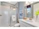 Modern bathroom featuring a glass-enclosed shower, sleek vanity, and contemporary fixtures for a clean aesthetic at 1224 Teal Creek Dr, St Cloud, FL 34771