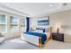 Beautiful bedroom with large windows, recessed lights, and a modern platform bed with luxury bedding at 1224 Teal Creek Dr, St Cloud, FL 34771
