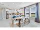 Bright dining area and open kitchen with island seating offer a modern living space at 1224 Teal Creek Dr, St Cloud, FL 34771