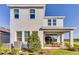 Rear exterior view showcases a covered patio, AC Unit, and lush green landscaping at 1224 Teal Creek Dr, St Cloud, FL 34771