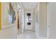Light and airy hallway featuring art and a frosted French door at 1224 Teal Creek Dr, St Cloud, FL 34771
