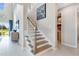 Staircase leading to the upper level and hallway area with view and natural light at 1224 Teal Creek Dr, St Cloud, FL 34771