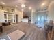 Spacious living room featuring wood floors, high ceilings, and plenty of natural light at 123 Breezy Oaks Ct, Davenport, FL 33896