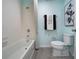 Well-lit bathroom with a shower-tub combo and modern fixtures at 1234 Sand Torch Cir, Davenport, FL 33837