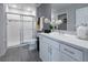 Bathroom featuring a shower with sliding glass doors, modern tiling, and a single sink vanity at 1234 Sand Torch Cir, Davenport, FL 33837