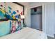 Bright bedroom with an accent wall and a closet at 1234 Sand Torch Cir, Davenport, FL 33837