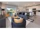 Open-concept living room flowing into the dining and kitchen area at 1234 Sand Torch Cir, Davenport, FL 33837