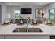 Open concept living room with stylish decor, modern lighting, and comfortable seating area at 1234 Sand Torch Cir, Davenport, FL 33837