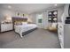 Bright main bedroom with a large bed, modern decor, and two bedside lamps at 1234 Sand Torch Cir, Davenport, FL 33837