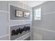 Elegant staircase featuring modern wall decor, neutral tones, and natural light at 1234 Sand Torch Cir, Davenport, FL 33837