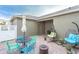 Backyard featuring a patio, chairs, a table, an umbrella, and hanging pod chairs at 12862 Strode Ln, Windermere, FL 34786