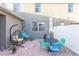 Backyard featuring a patio, chairs, a table, and an umbrella at 12862 Strode Ln, Windermere, FL 34786