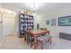Dining area with seating for six, tiled floors, and natural light at 12862 Strode Ln, Windermere, FL 34786
