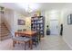 Dining area with seating for six, tiled floors, and stairs to the next level at 12862 Strode Ln, Windermere, FL 34786