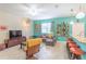 Open-concept living room showcases a large sofa, modern lighting, and views into the kitchen at 12862 Strode Ln, Windermere, FL 34786