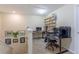 Upstairs loft area with desk, shelving, and neutral carpet at 12862 Strode Ln, Windermere, FL 34786