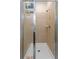 Tiled shower stall with glass doors and built-in shelving at 12862 Strode Ln, Windermere, FL 34786