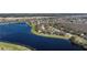 Breathtaking aerial view showcasing the lakeside condo community with lush landscaping at 13852 Timberbrooke Dr # 203, Orlando, FL 32824