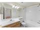 Standard bathroom featuring a bath and shower, vanity and updated fixtures at 13852 Timberbrooke Dr # 203, Orlando, FL 32824