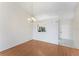 Bright dining room with wood floors leading to the kitchen at 13852 Timberbrooke Dr # 203, Orlando, FL 32824