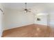 Open living room with ceiling fan, wood floors and plenty of space for gathering at 13852 Timberbrooke Dr # 203, Orlando, FL 32824