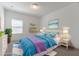 Bedroom with blue bedding and whimsical decor features a bright and cheerful design at 14007 Picard Aly, Winter Garden, FL 34787