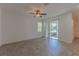 Spacious bedroom with tile flooring and sliding glass doors to the backyard at 14007 Picard Aly, Winter Garden, FL 34787