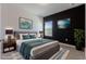Staged bedroom features stylish decor, a comfortable bed, and modern design elements at 14007 Picard Aly, Winter Garden, FL 34787