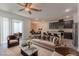 Open-concept living room featuring stylish furniture and a connection to the kitchen and patio at 14007 Picard Aly, Winter Garden, FL 34787