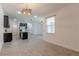 Bright living space featuring an open floor plan, seamlessly connecting to a modern kitchen with stainless appliances at 14007 Picard Aly, Winter Garden, FL 34787
