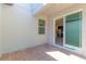 Private brick-paved patio with a sliding glass door to the kitchen at 14007 Picard Aly, Winter Garden, FL 34787
