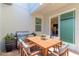 Cozy outdoor patio featuring a dining table and grill for outdoor entertaining at 14007 Picard Aly, Winter Garden, FL 34787