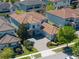 An aerial view of a two-story home with an attached garage and well-manicured landscaping at 14172 Hutchinson St, Winter Garden, FL 34787