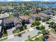 An aerial shot of a home situated within a community with a lake in the background at 14172 Hutchinson St, Winter Garden, FL 34787
