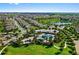 A community pool and clubhouse located near residences and a small lake, all surrounded by greenery at 14172 Hutchinson St, Winter Garden, FL 34787