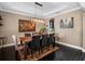 Well-lit dining room with a large dark wood table, perfect for Gathering gatherings and entertaining guests at 14172 Hutchinson St, Winter Garden, FL 34787