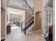 Open foyer with staircase leading to a second story, tiled floors, and access to the home's living spaces at 14172 Hutchinson St, Winter Garden, FL 34787