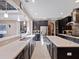 Bright, modern kitchen with dark cabinets, an island, and an open layout at 14172 Hutchinson St, Winter Garden, FL 34787