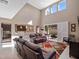 Spacious living room with high ceilings and an open view to the kitchen at 14172 Hutchinson St, Winter Garden, FL 34787